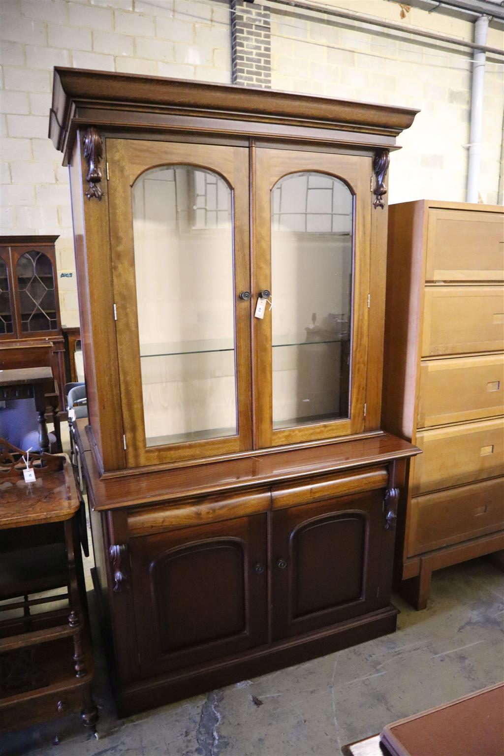 A pair of Victorian style mahogany bookcases, width 125cm, depth 50cm, height 218cm